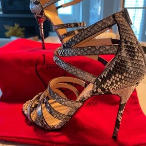 Gorgeous Christian Louboutin Snake Skin Stilettos and flawless condition.